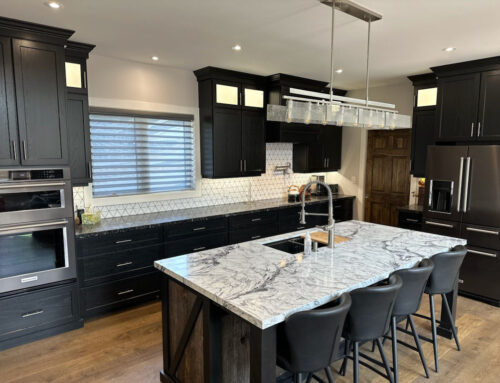 Black stained kitchen cupboards with Barn board island